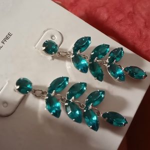 Teal blue green zirconia crystals dangling earrings. In gold tone.nwot